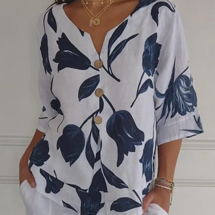 Elegante, feminine Bluse mit floralem Muster und spitzem Ausschnitt für einen einzigartigen Stil