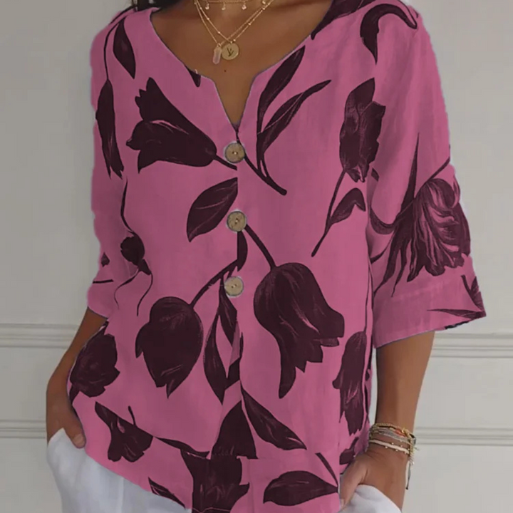 Elegante, feminine Bluse mit floralem Muster und spitzem Ausschnitt für einen einzigartigen Stil